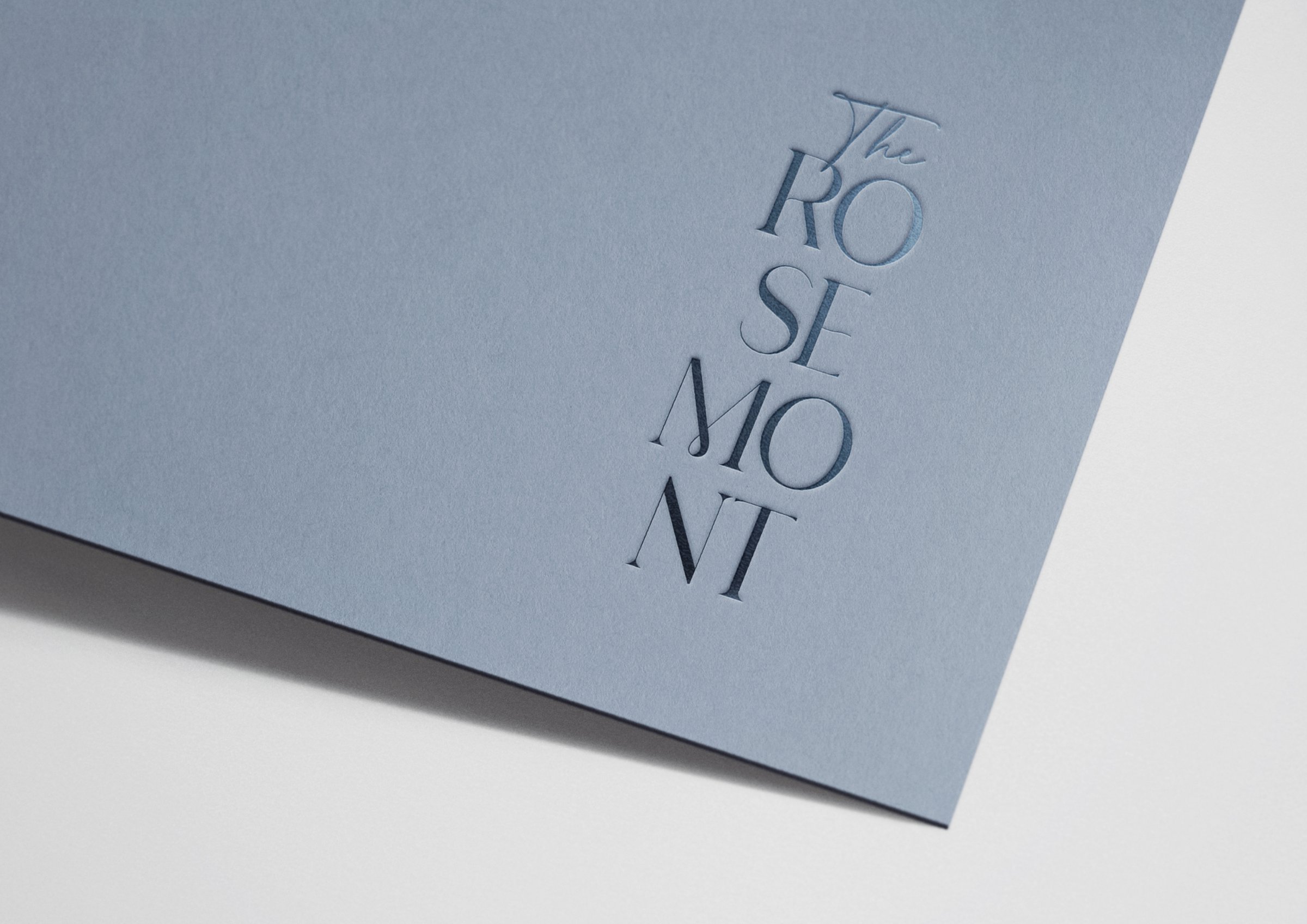 The Rosemont development brand identity — embossed logo on textured card stock by Ademchic