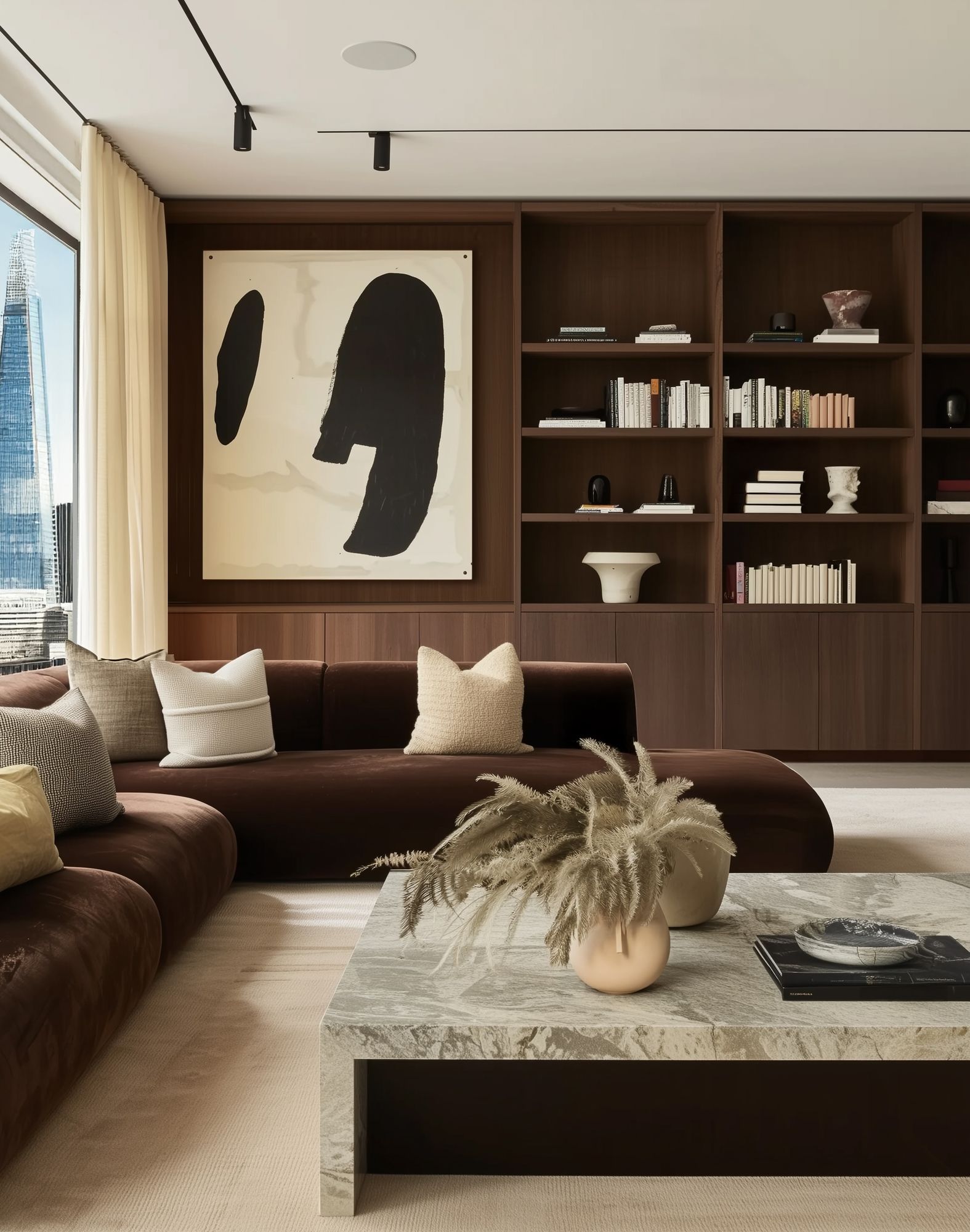 Contemporary living room with burgundy velvet sofa, walnut built-in shelving and marble coffee table