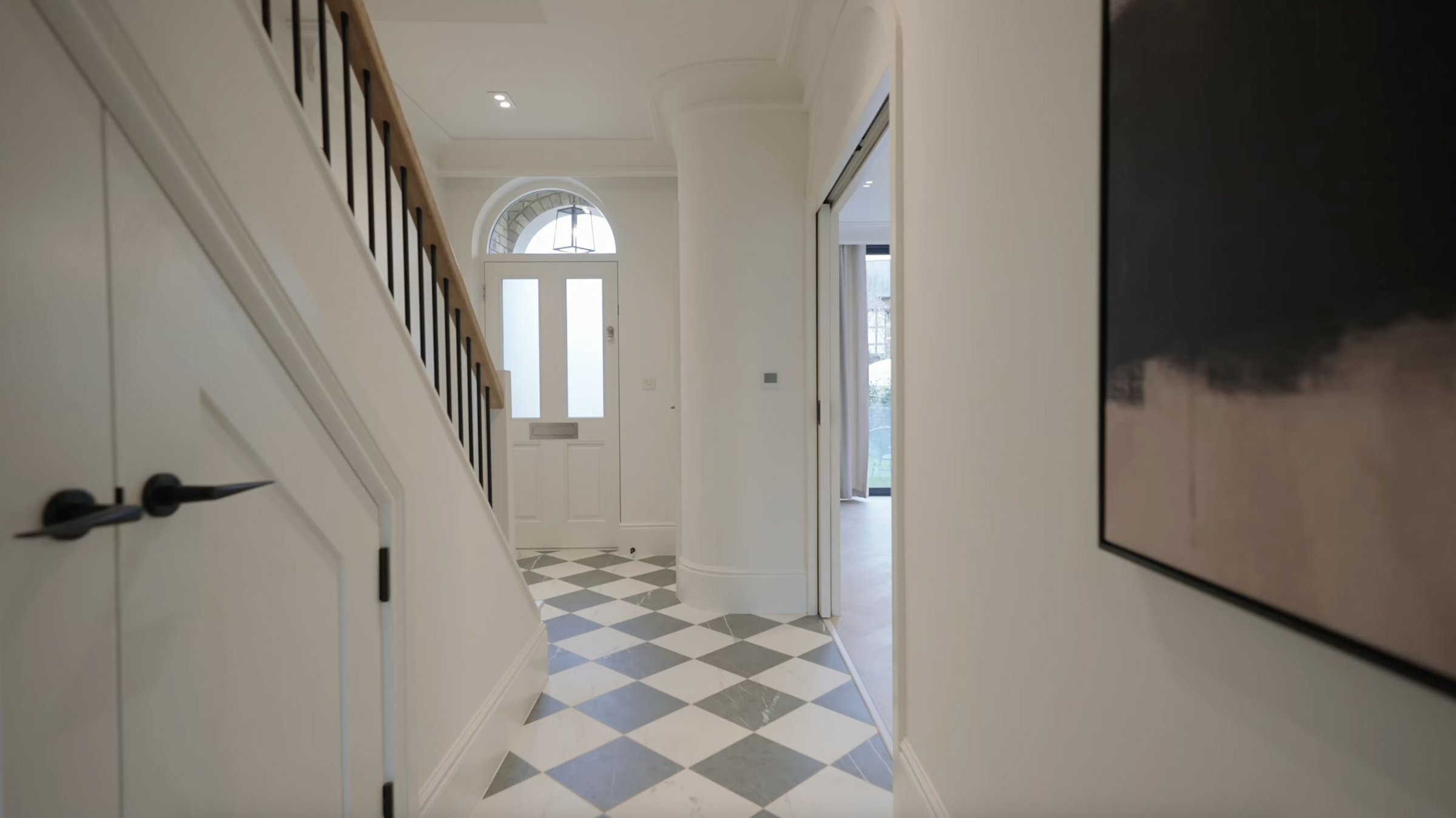 Montpelier-Mews-entrance hallway with marble checkerboard floor and arched window — interior design by Ademchic