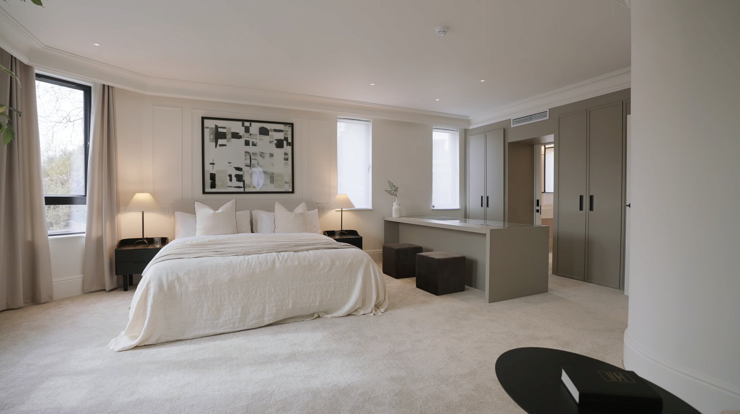 Montpelier-Mews-primary bedroom with wall panelling and artwork — designed by Ademchic