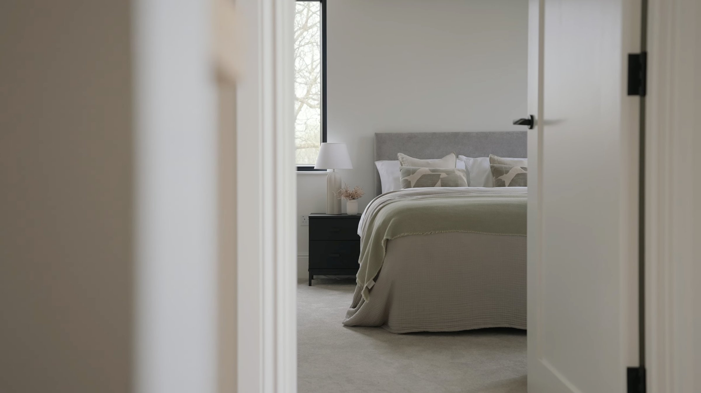 Montpelier-Mews-second bedroom viewed through doorway — residential interior by Ademchic